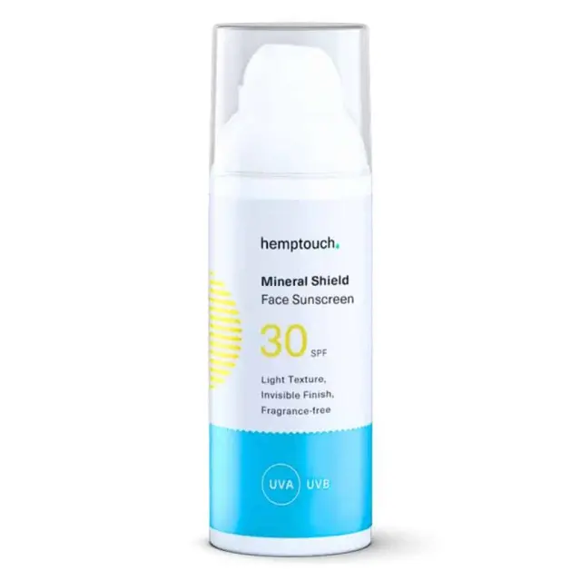 Hemptouch - Gezicht Zonnebrandcrème SPF30 - minerale bescherming (50ml) in een wit en blauw pompflesje met doorzichtige dop. Het label geeft aan dat het een lichte textuur heeft, een onzichtbare afwerking en geurvrij is met UVA- en UVB-bescherming.